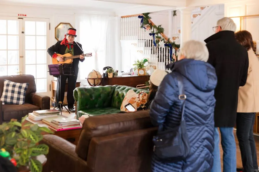 Man caroling during the holidays in the Berkshires at the Inn at Stockbridge