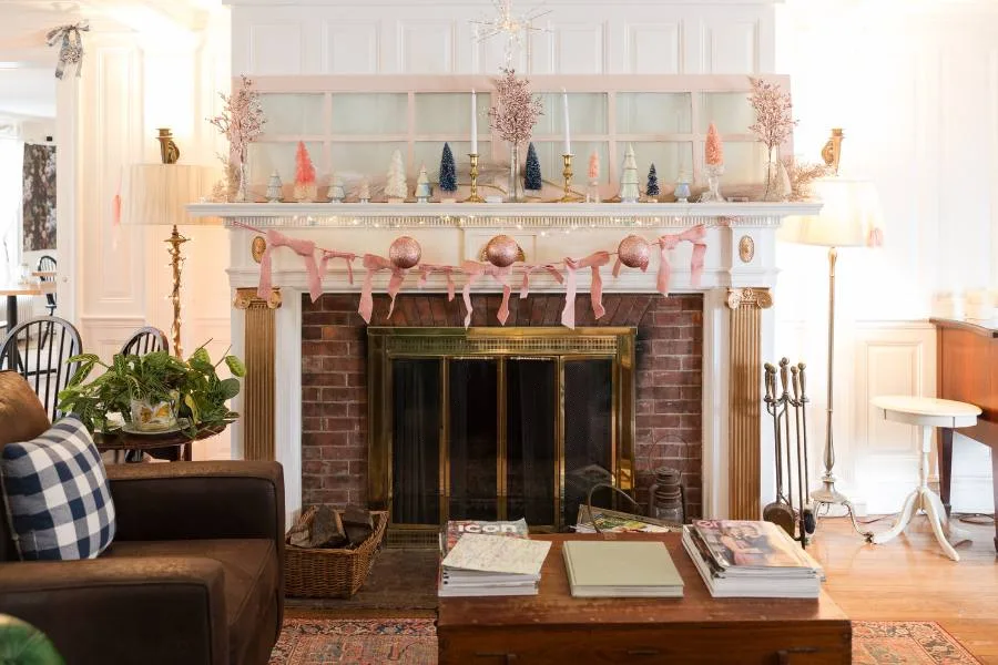 Festive holiday mantle above a fireplace at the Inn at Stockbridge