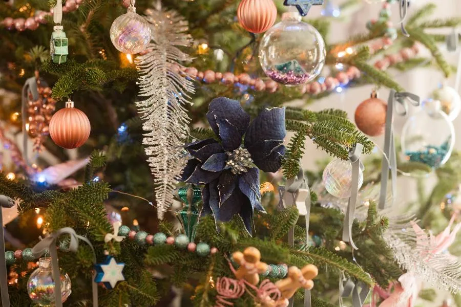 Tree decorated with a variety of holiday decor