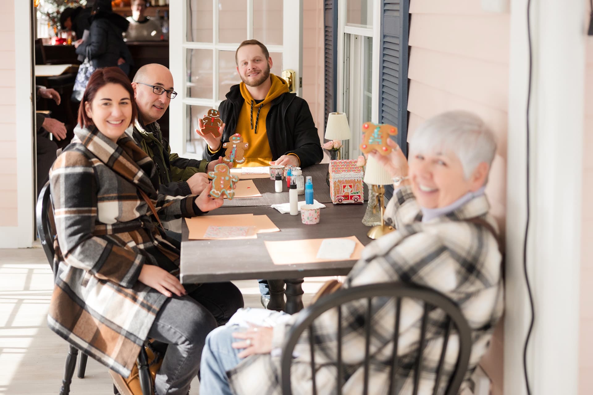 gathering of people making gingerbread cookies